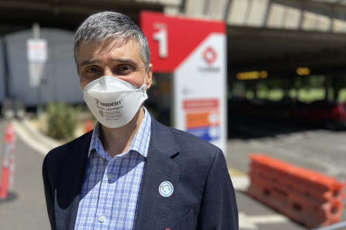 Deputy director of The Alfred's Burns Unit stands wearing an n95 mask.